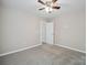 Neutral colored bedroom with ceiling fan and carpet flooring at 528 S Caldwell St, Salisbury, NC 28144