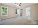 Bright bedroom featuring dual windows for ample natural light and an ensuite bathroom at 528 S Caldwell St, Salisbury, NC 28144