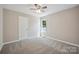 Bedroom featuring carpet, ceiling fan, and natural light at 528 S Caldwell St, Salisbury, NC 28144