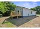 Back of house featuring backyard and a wood deck at 528 S Caldwell St, Salisbury, NC 28144