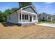 Attractive single-story home featuring a covered front porch, complemented by fresh landscaping at 528 S Caldwell St, Salisbury, NC 28144