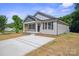Well-maintained single-story home with a concrete driveway and freshly landscaped front yard at 528 S Caldwell St, Salisbury, NC 28144