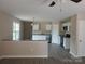 Bright kitchen featuring white cabinetry, granite countertops, and stainless steel appliances at 528 S Caldwell St, Salisbury, NC 28144