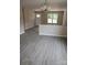 Open-concept living room featuring modern flooring and neutral paint at 528 S Caldwell St, Salisbury, NC 28144
