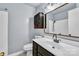 Bathroom with sleek vanity, stylish mirror, modern lighting, and shower/tub combination at 5633 Mallard S Dr, Charlotte, NC 28227