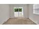 Bedroom with carpeted floors and sliding doors to a sunroom at 5633 Mallard S Dr, Charlotte, NC 28227