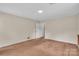 Spacious bedroom featuring neutral walls and carpeted floors at 5633 Mallard S Dr, Charlotte, NC 28227