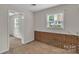 Comfortable bedroom features with natural light, carpeted flooring and brick accents at 5633 Mallard S Dr, Charlotte, NC 28227