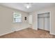Cozy bedroom featuring a window, neutral walls, and a spacious closet at 5633 Mallard S Dr, Charlotte, NC 28227