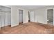 A spacious bedroom with neutral walls, carpeted floors and two closets for ample storage space at 5633 Mallard S Dr, Charlotte, NC 28227