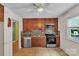 A kitchen featuring wood cabinets, stainless steel appliances, and tile backsplash at 5633 Mallard S Dr, Charlotte, NC 28227