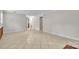 Open-concept living room with neutral paint, tiled floor, and ample space at 5633 Mallard S Dr, Charlotte, NC 28227
