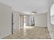 Spacious living room with tile floors, sliding glass doors, and abundant natural light at 5633 Mallard S Dr, Charlotte, NC 28227