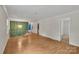 Open living room with hardwood floors and elegant lighting, perfect for entertaining at 5633 Mallard S Dr, Charlotte, NC 28227