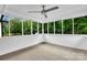 Sunroom featuring an abundance of windows and a ceiling fan at 5633 Mallard S Dr, Charlotte, NC 28227