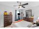 Bedroom with two dressers and a bright window with a ceiling fan overhead at 6104 Follow The Trl, Indian Trail, NC 28079