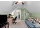 Relaxing bonus room showcasing neutral carpet, a plush couch, and a convenient desk area at 6104 Follow The Trl, Indian Trail, NC 28079