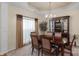 The dining room features a wood table, six chairs, and a glass cabinet in the background at 6104 Follow The Trl, Indian Trail, NC 28079