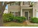 Well-maintained home with a cozy front porch framed by green bushes and lush landscaping at 6104 Follow The Trl, Indian Trail, NC 28079