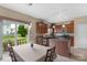 Bright kitchen and dining area with stainless steel appliances and access to outdoor patio at 6104 Follow The Trl, Indian Trail, NC 28079