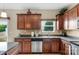 Functional kitchen with stainless steel appliances, dark countertops, and tile backsplash at 6104 Follow The Trl, Indian Trail, NC 28079