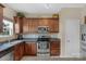 Modern kitchen featuring stainless steel appliances, dark wood cabinetry, and stylish countertops at 6104 Follow The Trl, Indian Trail, NC 28079
