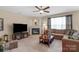 Inviting living room with a cozy fireplace, plush seating, and ample natural light at 6104 Follow The Trl, Indian Trail, NC 28079