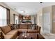 Open-concept living room with a comfortable sofa and a view into the modern kitchen at 6104 Follow The Trl, Indian Trail, NC 28079