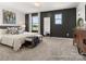 Well-lit bedroom with plush bedding and a large mirror against a dark accent wall at 616 Station St # 45, Clover, SC 29710