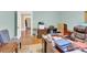 This is an office with hardwood floors, dark wood furniture, neutral paint, and a view at 634 E Center Ave, Mooresville, NC 28115