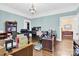 This is an office featuring dark wood floors, a chandelier, neutral paint and lots of storage space at 634 E Center Ave, Mooresville, NC 28115