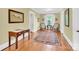 Inviting sitting room with classic furnishings, a patterned rug, and natural light at 634 E Center Ave, Mooresville, NC 28115