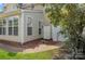 Exterior home view featuring a brick walkway leading to a private backyard with a fence at 6614 Truman St, Indian Trail, NC 28079