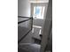 A grand two-story foyer featuring a staircase and a statement chandelier, creating an impressive and welcoming entrance at 6614 Truman St, Indian Trail, NC 28079