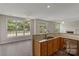 Open concept kitchen with granite countertops and stainless steel appliances; a seamless space at 6614 Truman St, Indian Trail, NC 28079