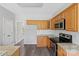 This spacious kitchen offers wooden cabinets, stainless steel appliances, and light countertops at 6614 Truman St, Indian Trail, NC 28079