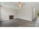 Cozy living room with a classic fireplace, neutral colors, and plenty of space at 6614 Truman St, Indian Trail, NC 28079