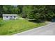 Charming single story cottage-style home with a small porch and a lush green lawn at 6649 Mountain Grove Rd, Hickory, NC 28602