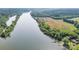 Expansive aerial shot capturing a riverfront property with a private dock and tranquil surroundings at 6822 Zelda Dr, Catawba, NC 28609