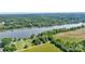 Picturesque aerial view showcasing a waterfront property and scenic river, surrounded by green forest at 6822 Zelda Dr, Catawba, NC 28609