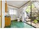 Well-lit bathroom with unique green flooring and natural light at 6822 Zelda Dr, Catawba, NC 28609