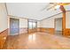 Cozy living room featuring wood-paneled walls and a welcoming entryway at 6822 Zelda Dr, Catawba, NC 28609