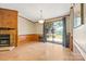Bright living room with stone fireplace and access to a backyard lake view at 6822 Zelda Dr, Catawba, NC 28609