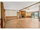 Open living room with a stone fireplace and sliding door to the lake at 6822 Zelda Dr, Catawba, NC 28609