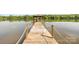 Long wooden pier leading out to a gazebo on the water at 6822 Zelda Dr, Catawba, NC 28609