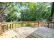 Large wooden deck overlooking backyard with beautiful trees in the background at 6822 Zelda Dr, Catawba, NC 28609