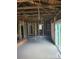 Interior view of a home under construction, featuring exposed wooden beams and framing and a sliding glass door at 720 Mutual Rd, Gastonia, NC 28052