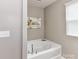 Bright bathroom featuring a soaking tub with chrome fixtures at 7325 Overmountain Dr, Rock Hill, SC 29732