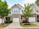 Charming townhome featuring a one-car garage, manicured lawn, and welcoming curb appeal at 7325 Overmountain Dr, Rock Hill, SC 29732