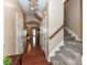 Bright hallway connecting multiple rooms with hardwood floors and carpeted stairs at 7325 Overmountain Dr, Rock Hill, SC 29732